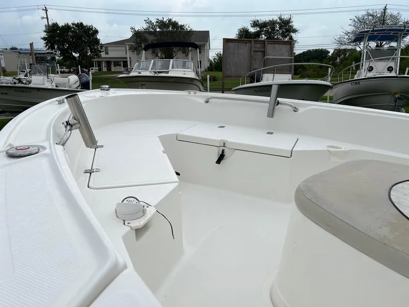 Slide: The Image of 2015 Mako 184 CC boat interior with seating and storage compartments. - 5