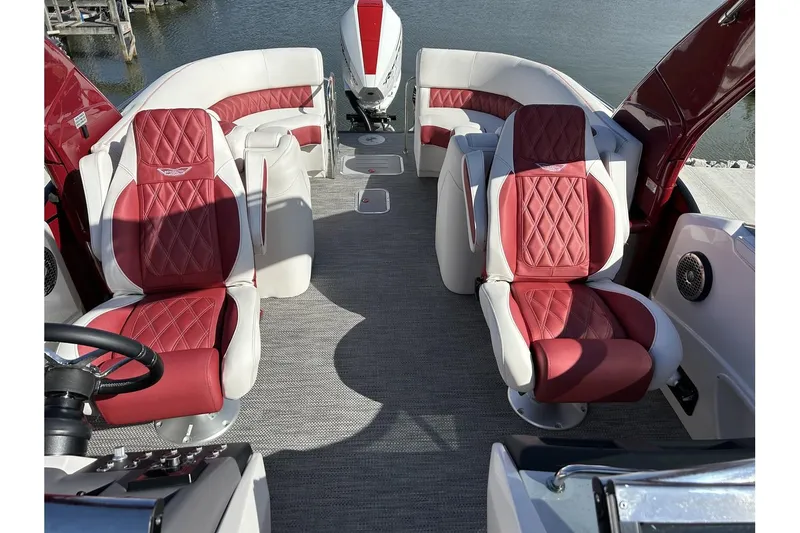 Slide: The Image of 2023 Bennington QX Sport 25 interior with red and white seating. - 7