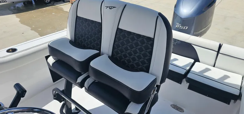 Slide: The Image of 2023 Tidewater 232 LXF boat seats with stylish black and white design. - 16