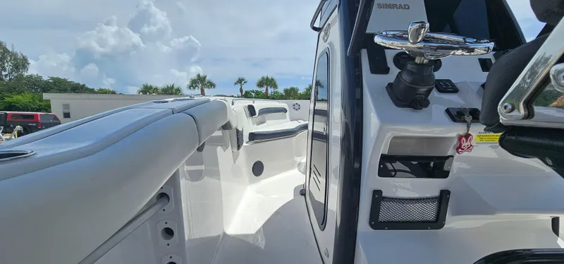 Slide: The Image of 2023 Tidewater 232 LXF boat interior with modern controls and seating. - 21