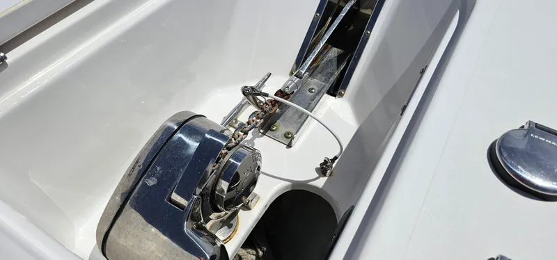 Slide: The Image of 2023 Tidewater 232 LXF boat anchor system, chrome finish, close-up view. - 29