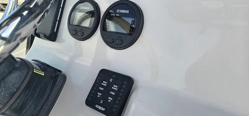 Slide: The Image of Close-up of 2023 Tidewater 232 LXF boat dashboard with Yamaha gauges and controls. - 9
