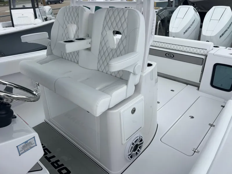 Slide: The Image of 2025 Sportsman Open 322 Center Console interior with white seating and modern design. - 20