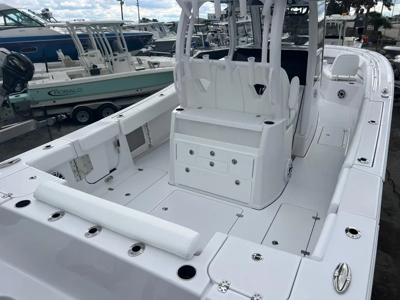 Slide: The Image of 2025 Sportsman Open 322 Center Console boat interior with seating and storage compartments. - 8