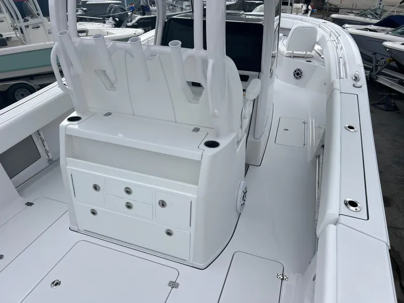 Slide: The Image of 2025 Sportsman Open 322 Center Console boat interior with seating and storage compartments. - 9