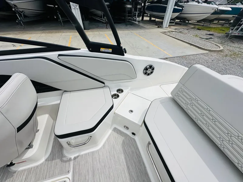 Slide: The Image of Interior seating of 2025 Sea Ray SPX 210 boat with white and black upholstery. - 15