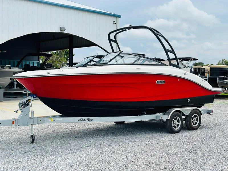 Slide: The Image of 2025 Sea Ray SPX 210 boat with red and black hull on a trailer. - 4