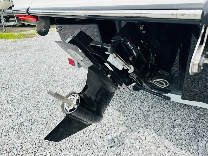 Slide: The Image of 2025 Sea Ray SPX 210 boat with MerCruiser outdrive on gravel. - 7