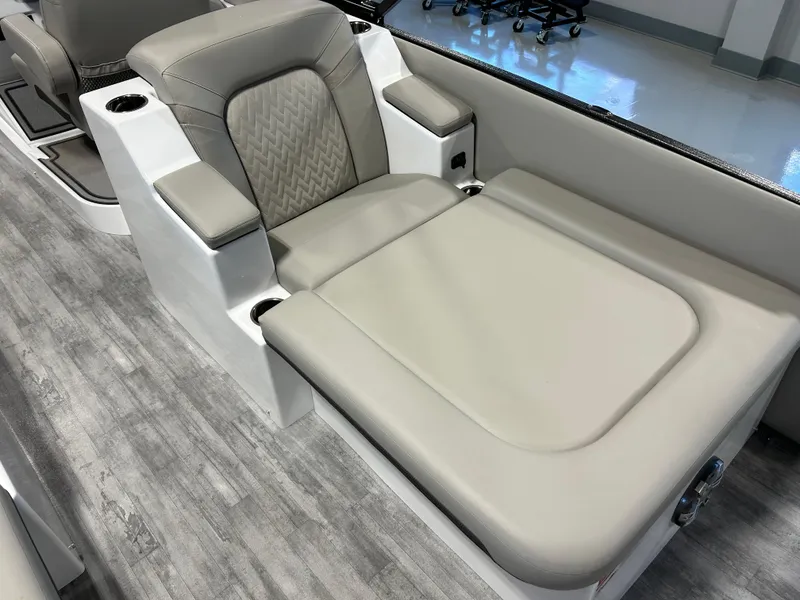 Slide: The Image of 2024 Crest Caribbean Platinum 250 SLRC CP3 boat interior seating with gray upholstery. - 10