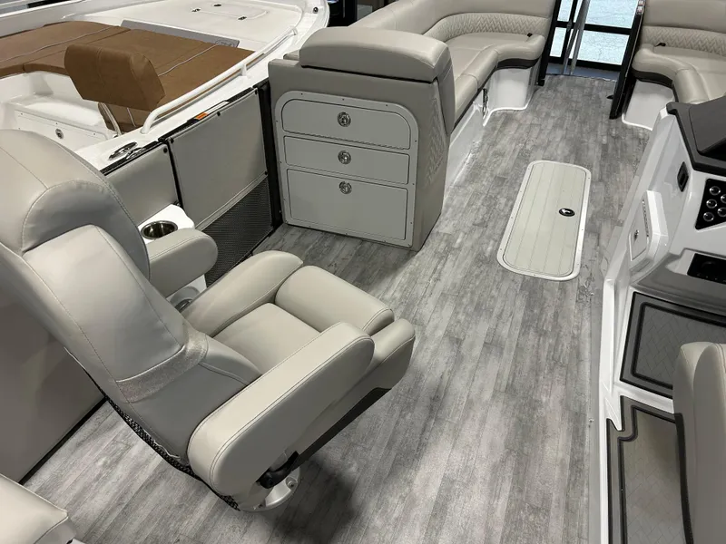 Slide: The Image of Interior of 2024 Crest Caribbean Platinum 250 SLRC CP3 pontoon boat with luxurious seating. - 13