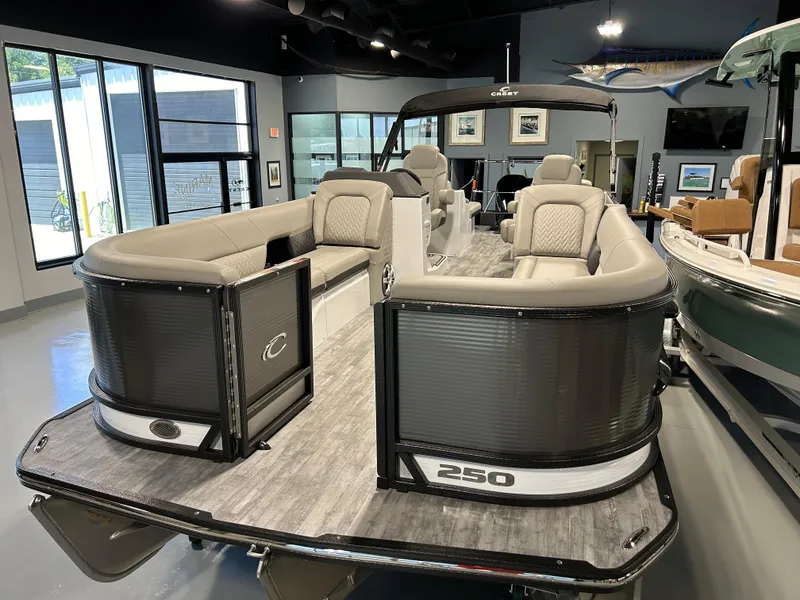 Slide: The Image of 2024 Crest Caribbean Platinum 250 SLRC CP3 pontoon boat in showroom. - 4
