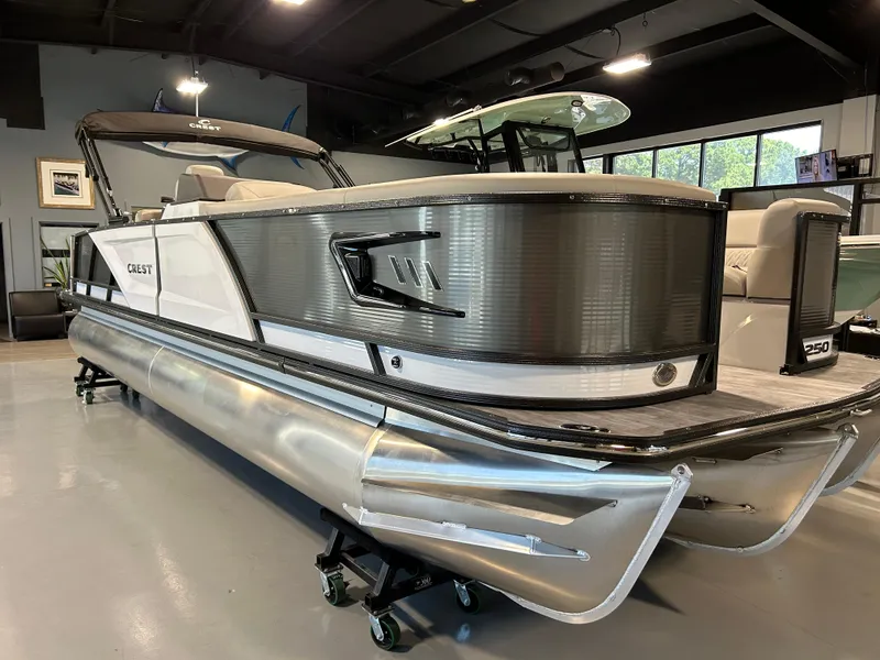 Slide: The Image of 2024 Crest Caribbean Platinum 250 SLRC CP3 pontoon boat in showroom. - 5