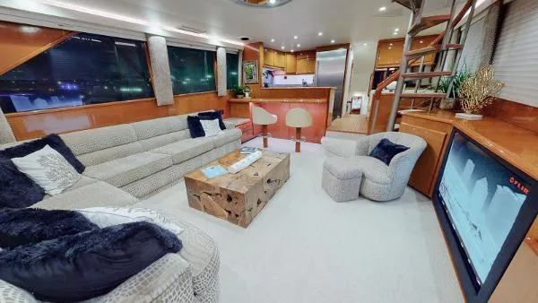 Slide: The Image of Luxurious interior of a 1999 Viking 72 Sport Fish yacht with modern furnishings. - 10