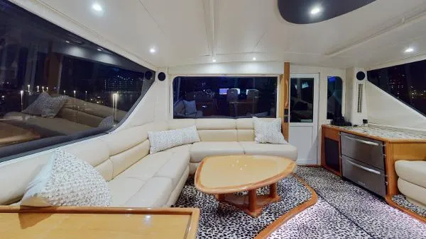 Slide: The Image of Luxurious interior of a 1999 Viking 72 Sport Fish yacht with modern furnishings. - 12