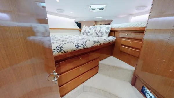 Slide: The Image of Luxurious bedroom interior of 1999 Viking 72 Sport Fish yacht with wooden cabinetry. - 14