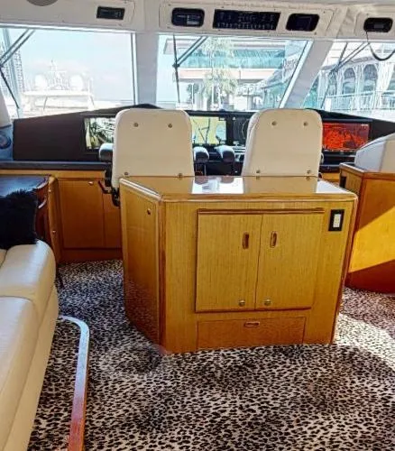 Slide: The Image of Interior of 1999 Viking 72 Sport Fish yacht with leopard print carpet. - 17