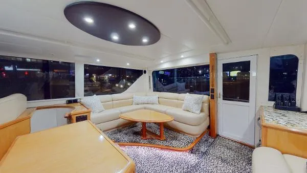 Slide: The Image of Luxurious interior of a 1999 Viking 72 Sport Fish yacht with modern lighting. - 20