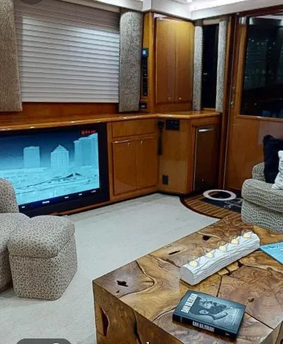 Slide: The Image of Luxurious interior of a 1999 Viking 72 Sport Fish yacht with modern amenities. - 23