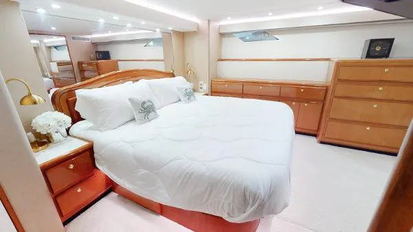 Slide: The Image of Luxurious bedroom interior of 1999 Viking 72 Sport Fish yacht with king-size bed. - 24