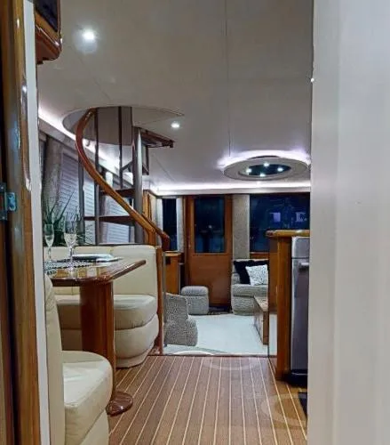Slide: The Image of Interior of a 1999 Viking 72 Sport Fish yacht with modern furnishings. - 27