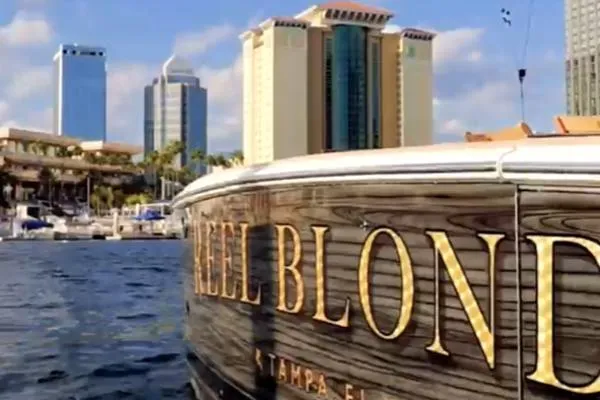 Slide: The Image of 1999 Viking 72 Sport Fish boat docked in Tampa, Florida with city skyline in background. - 3