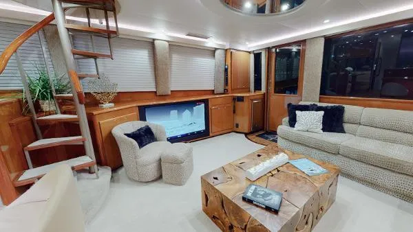 Slide: The Image of Luxurious interior of a 1999 Viking 72 Sport Fish yacht with modern furnishings. - 32