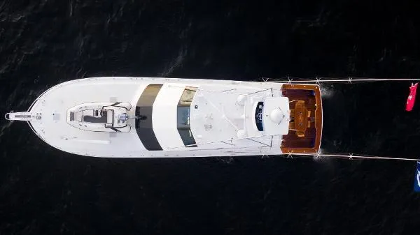 Slide: The Image of Aerial view of 1999 Viking 72 Sport Fish yacht on dark water. - 4