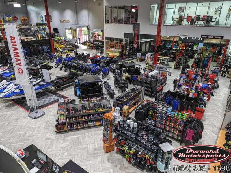 Slide: The Image of Showroom with 2024 Yamaha Boats VX® Limited HO, motorcycles, and accessories at Broward Motorsports. - 26