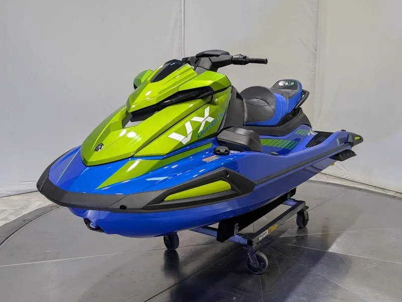 Slide: The Image of 2024 Yamaha VX® Limited HO jet ski in vibrant green and blue on display. - 30