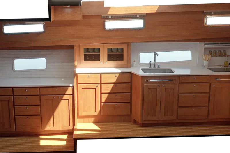 Slide: The Image of Luxurious interior of 2026 Sabre 51 Salon Express yacht with wooden cabinetry and modern kitchen. - 15