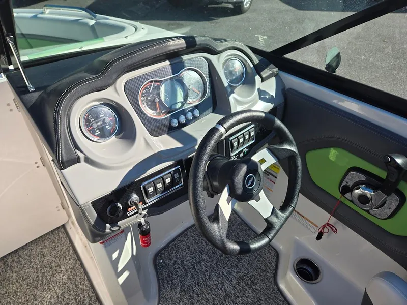 Slide: The Image of 2015 Chaparral 203V boat dashboard with steering wheel and instrument panel. - 6