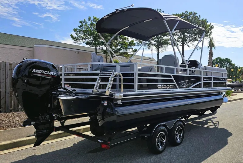 Slide: The Image of 2024 Ranger Reata 220FC pontoon boat with Mercury engine on trailer. - 3