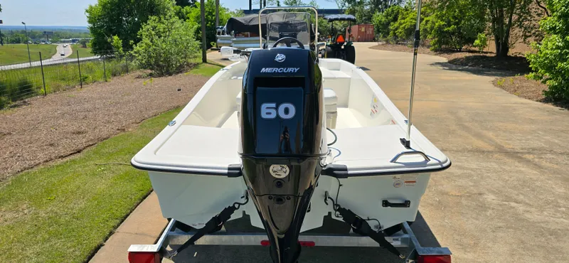 Slide: The Image of 2024 Mako Pro Skiff 15 CC with Mercury 60 engine on trailer. - 5