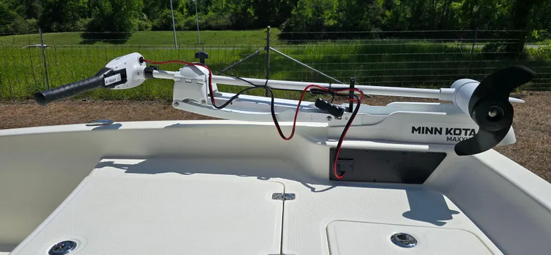 Slide: The Image of 2024 Mako Pro Skiff 15 CC with Minn Kota trolling motor on deck. - 7