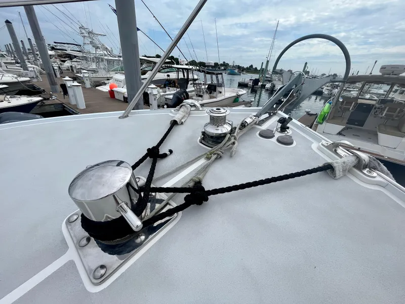 Slide: The Image of 2016 Wesmac 42 boat with large windows and docked fishing rods. - 18