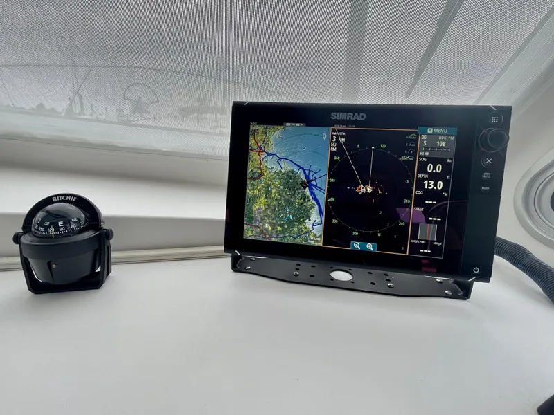 Slide: The Image of Simrad marine display on 2016 Wesmac 42 boat, showing navigation and sonar data. - 37
