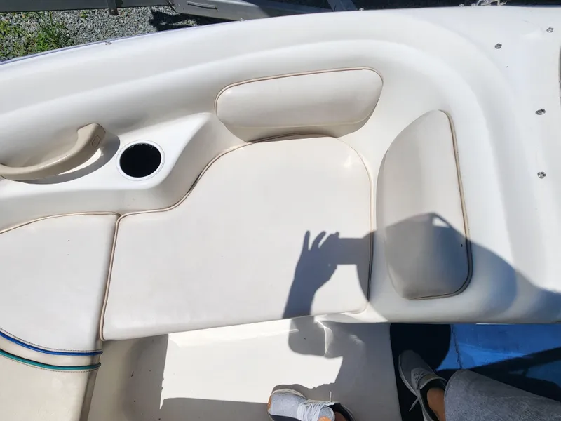 Slide: The Image of Interior seating of a 1997 Sea Ray 175 Five Series boat with cup holder. - 19