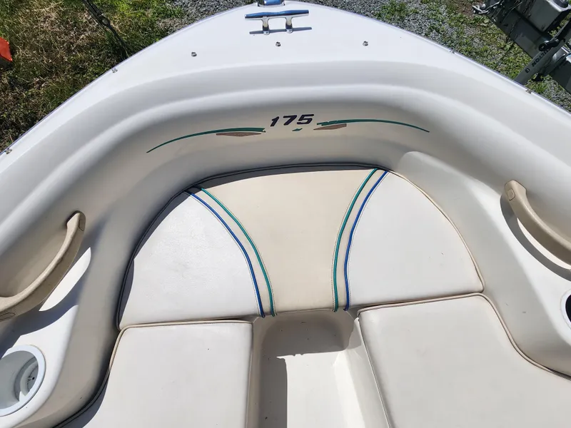 Slide: The Image of 1997 Sea Ray 175 Five Series boat interior with white and beige seating. - 21
