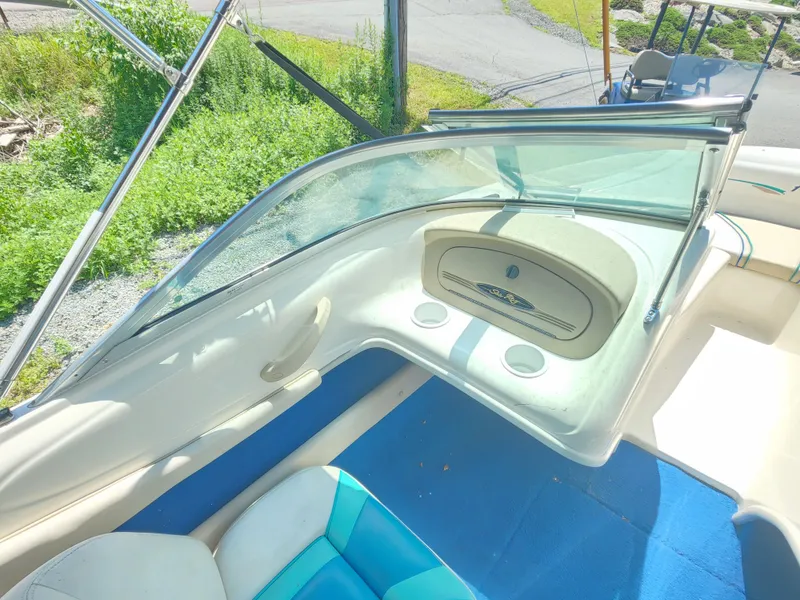 Slide: The Image of 1997 Sea Ray 175 Five Series boat interior with blue and white seating. - 8