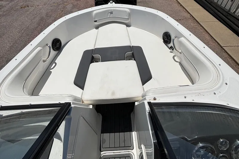 Slide: The Image of 2023 Bayliner VR4 boat interior with white seating and black accents. - 5