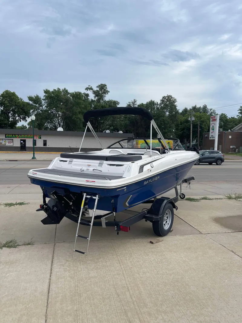 Slide: The Image of 2023 Bayliner VR4 boat on trailer, rear view, blue and white. - 3