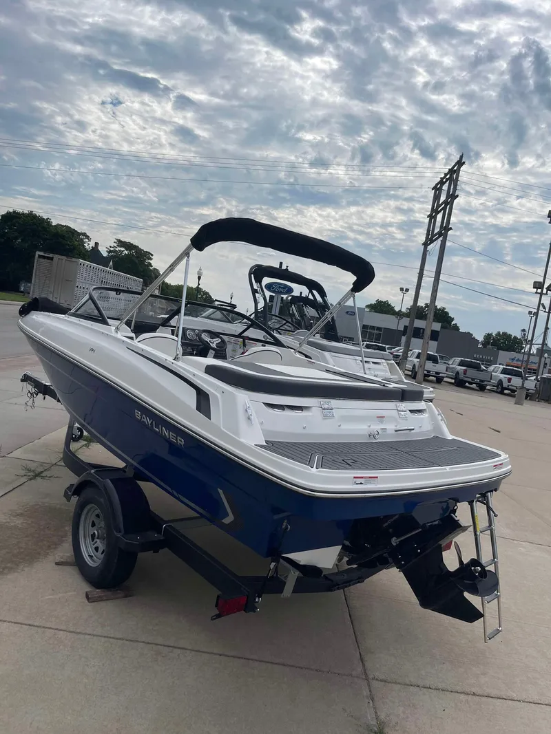 Slide: The Image of 2023 Bayliner VR4 boat on a trailer, ready for transport. - 4