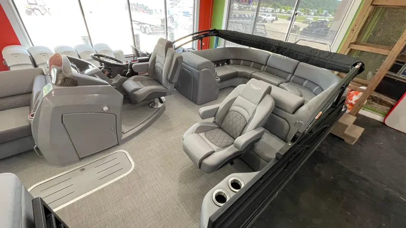 Slide: The Image of 2024 Bennington 23LFB pontoon boat interior with luxurious seating and modern helm. - 7