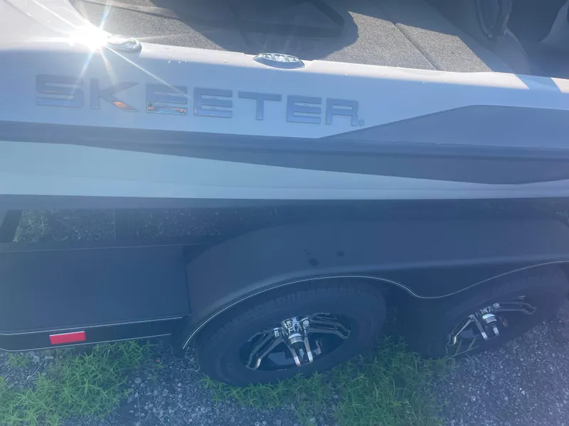 Slide: The Image of 2025 Skeeter ZXR 20 boat on a trailer, side view with logo visible. - 3