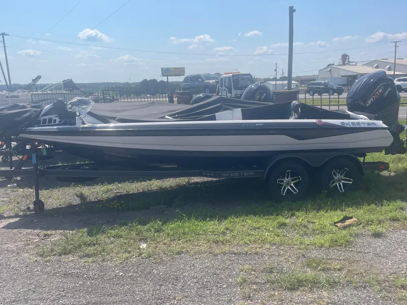 Slide: The Image of 2025 Skeeter ZXR 20 fishing boat on a trailer in an outdoor lot. - 8