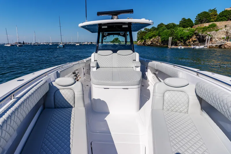 Slide: The Image of 2024 HCB 39 Speciale luxury boat with white quilted seating on a sunny day. - 16