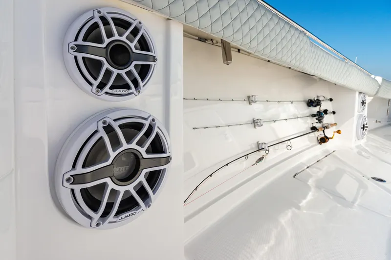 Slide: The Image of 2024 HCB 39 Speciale boat with mounted speakers and fishing rods. - 18