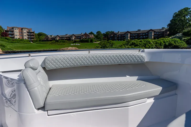 Slide: The Image of 2024 HCB 39 Speciale boat with luxurious seating and scenic background. - 20