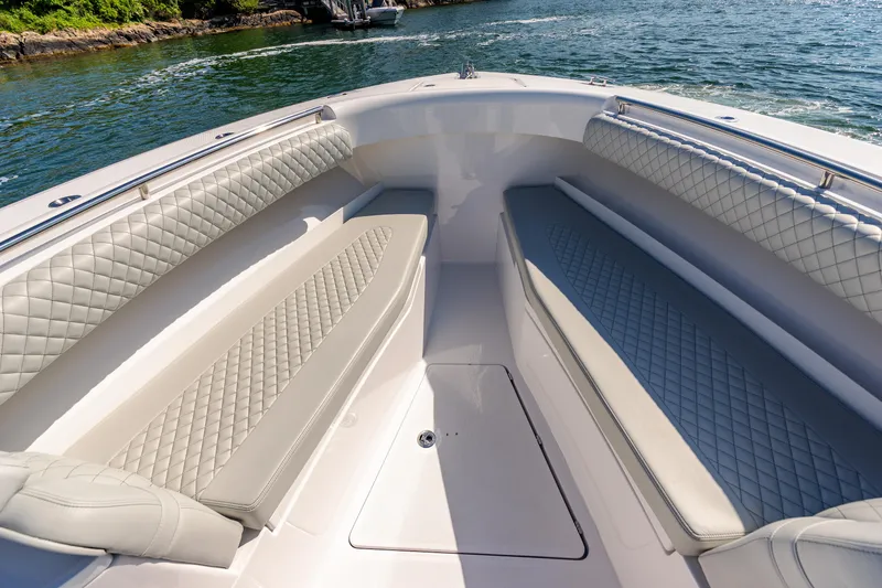 Slide: The Image of 2024 HCB 39 Speciale boat interior with diamond-stitched seating, on a sunny day. - 21