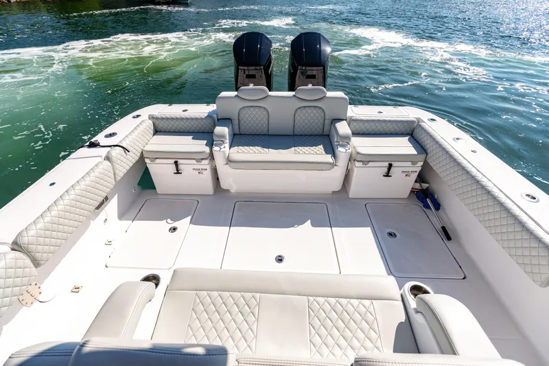 Slide: The Image of 2024 HCB 39 Speciale boat interior with luxurious seating and twin engines. - 24